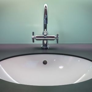black and white vanity top with stainless steel faucet