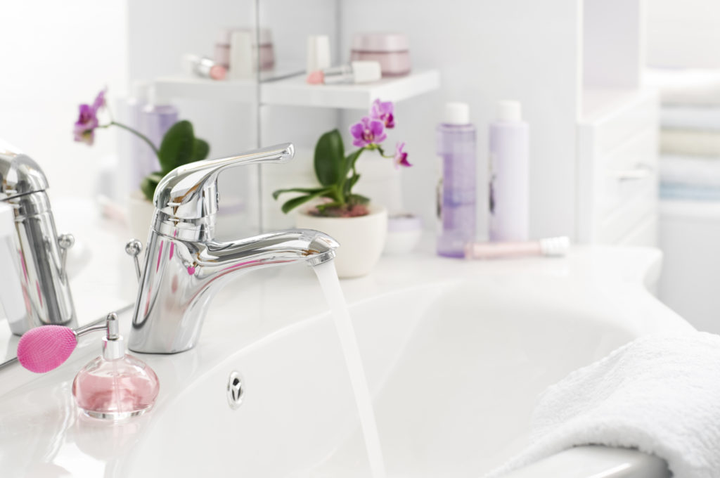 Bathroom sink with pink flowers | how to choose a faucet | Weinstein Collegeville